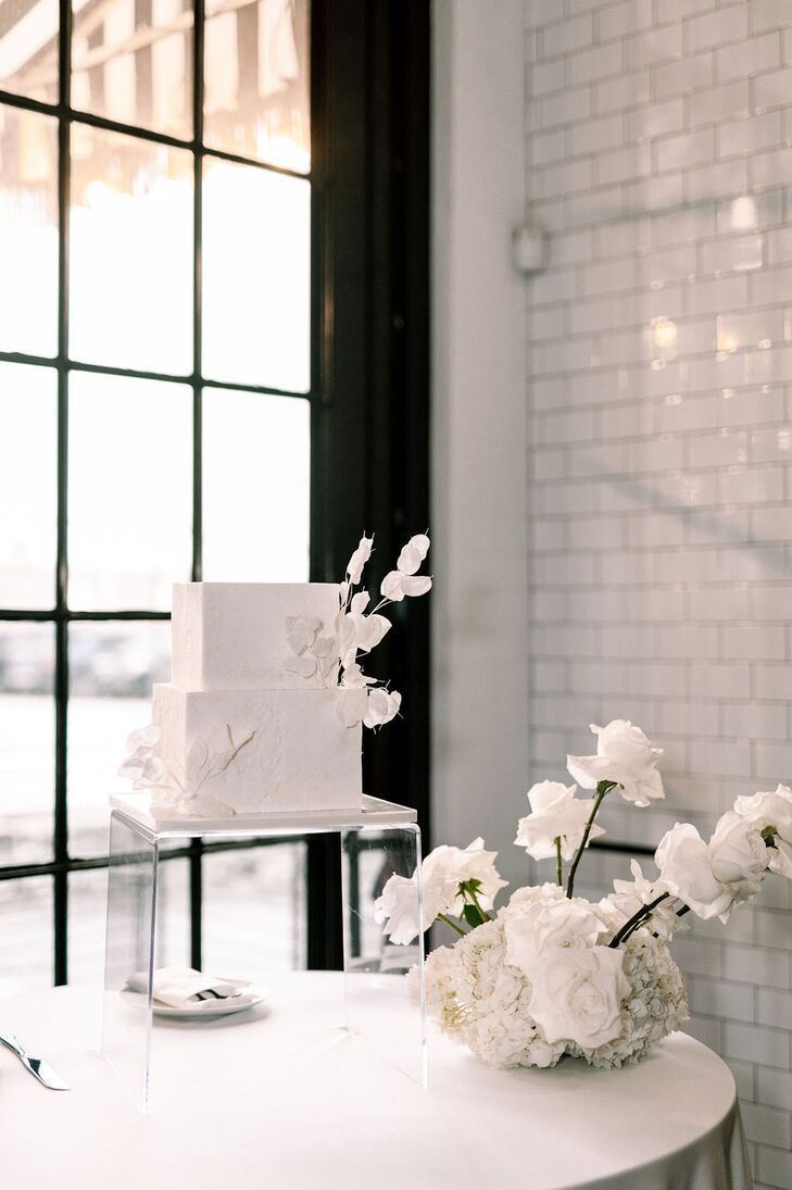 Two-Tier White Wedding Cake With White Flowers, Low Arrangement