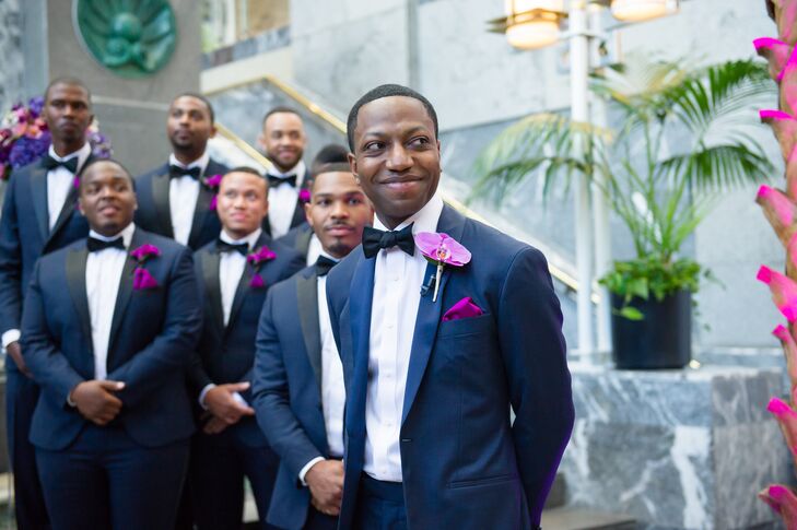 Bart paired his custom-made navy tuxedo with a black bow tie, fuchsia pocket square and orchid boutonniere for a contemporary look.
