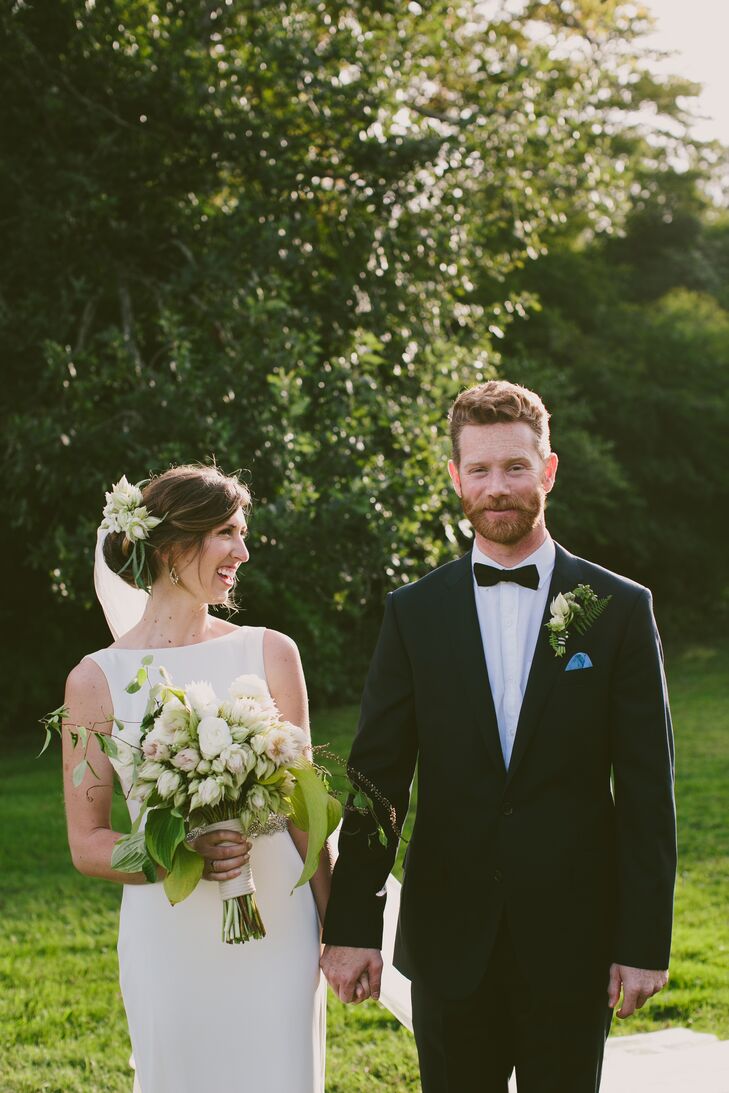 Tyler put a modern twist on a classic “I do” ensemble by opting for a navy J.Crew suit, which he paired with a sharp white dress shirt and a black bow tie. “Tyler is a sneaker freak and wears Vans about 360 days a year. So we put him in black-and-white-checkerboard Vans—classic but with a twist,” Erin says. “I also dyed a shibori pocket square for him to tie it all together.”