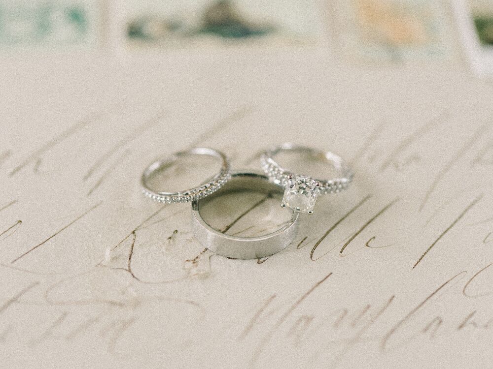 Engagement rings and wedding band stacked