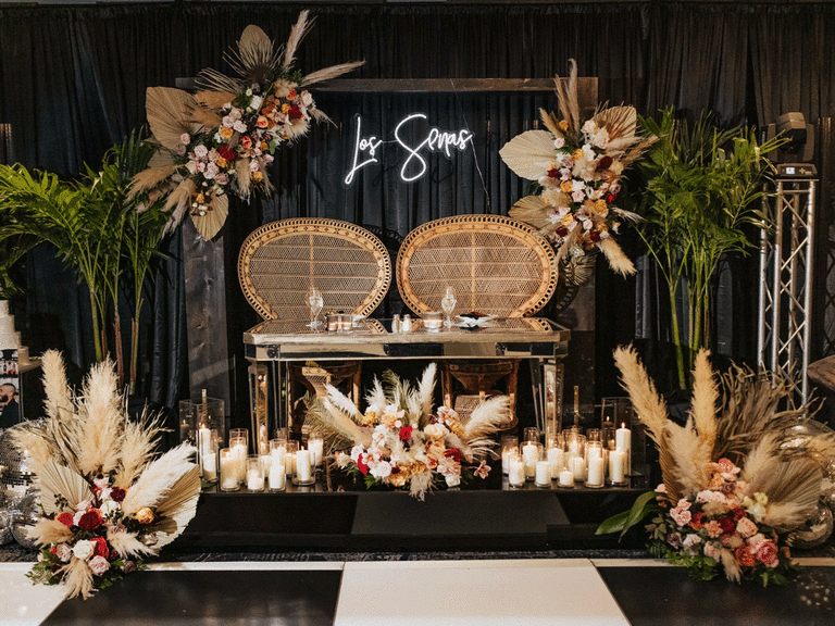 Boho chic sweetheart table at a wedding reception.