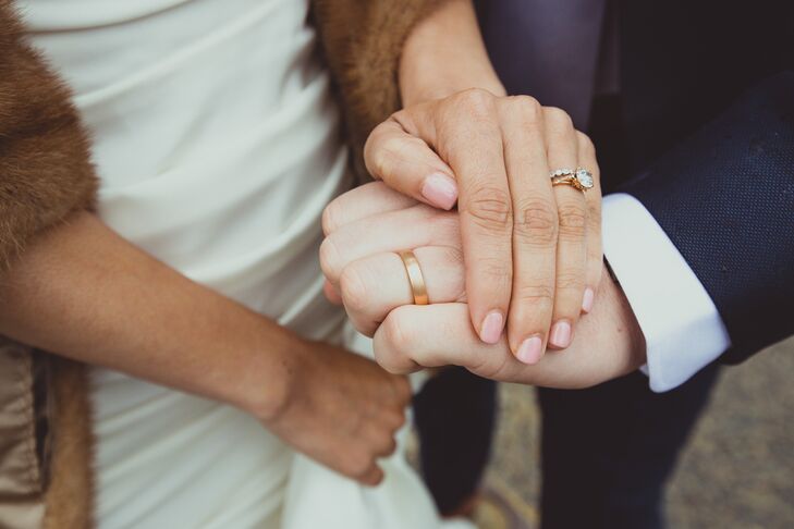 Engagement and Wedding Rings on Couple