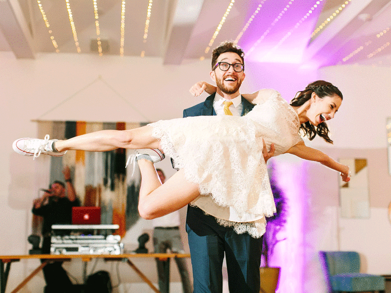 Bride and groom doing their wedding dance and lift.