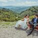 Couple Sitting With Natural Backdrop