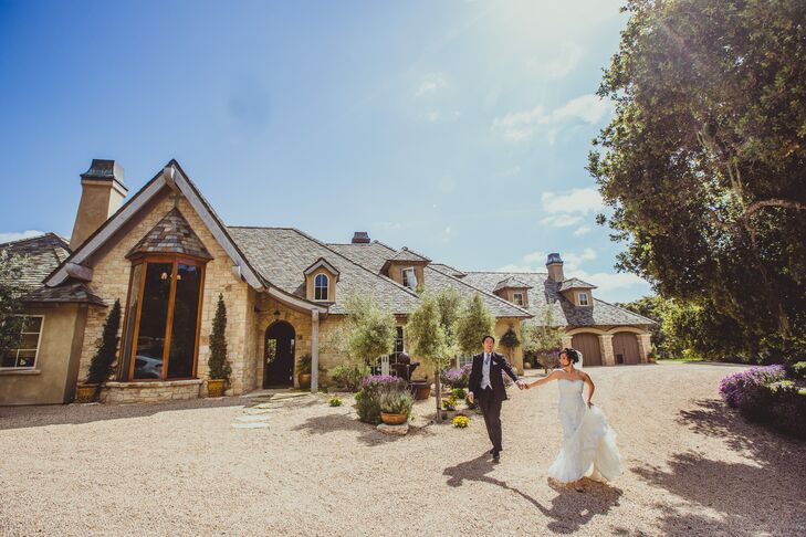 The bride and groom walk outside near one of the large houses the rented for their weekend wedding retreat.