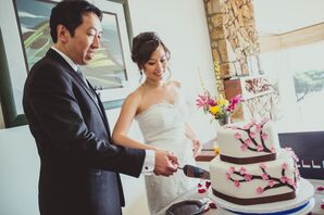 Married Couple Cutting Wedding Cake