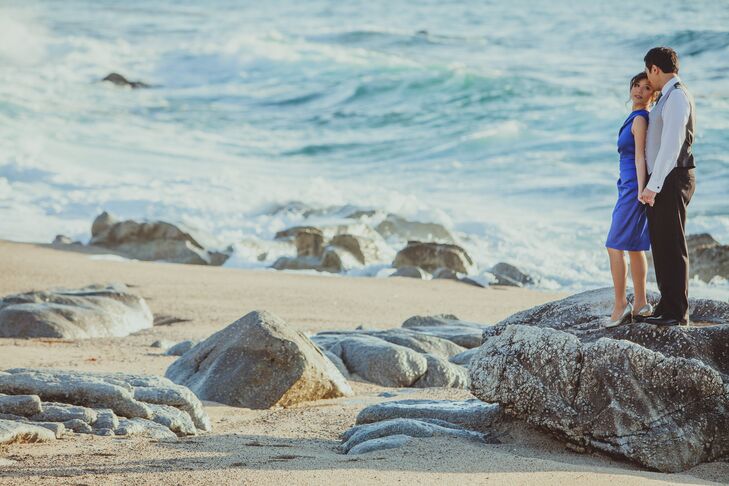 Carol and Andrew stood near the Waterfront at the beach in Carmel and shared an intimate moment as the waves glided over the rocks.