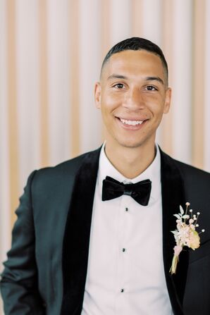 Groom in Tux With Bowtie and Boho Boutonniere
