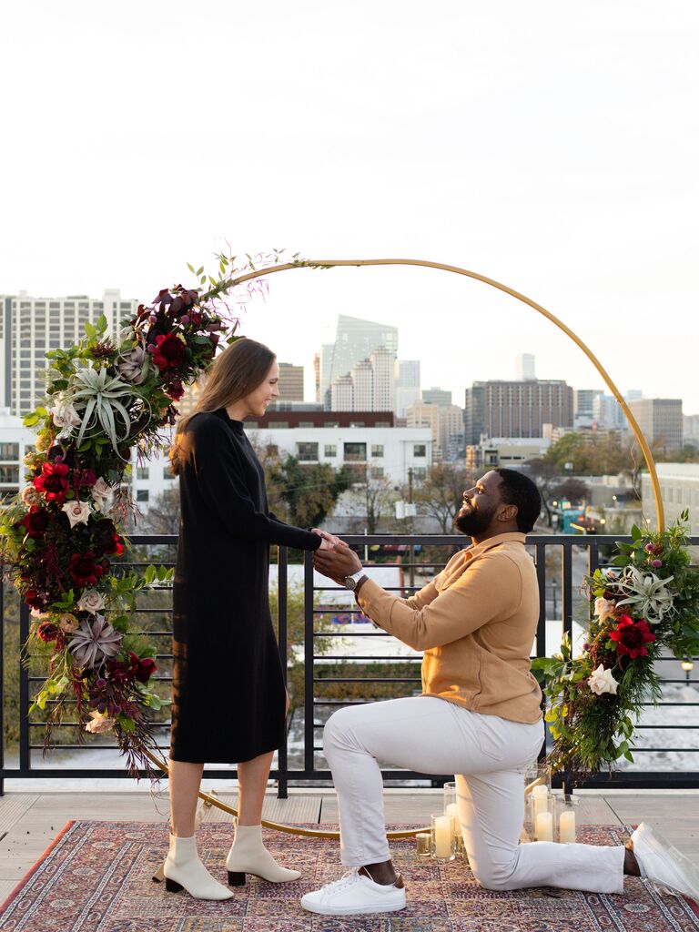 couple proposing on a rooftop