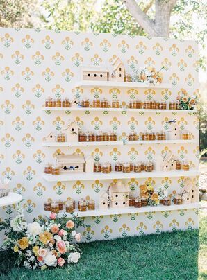 Escort Card Display Wall With Jars of Honey