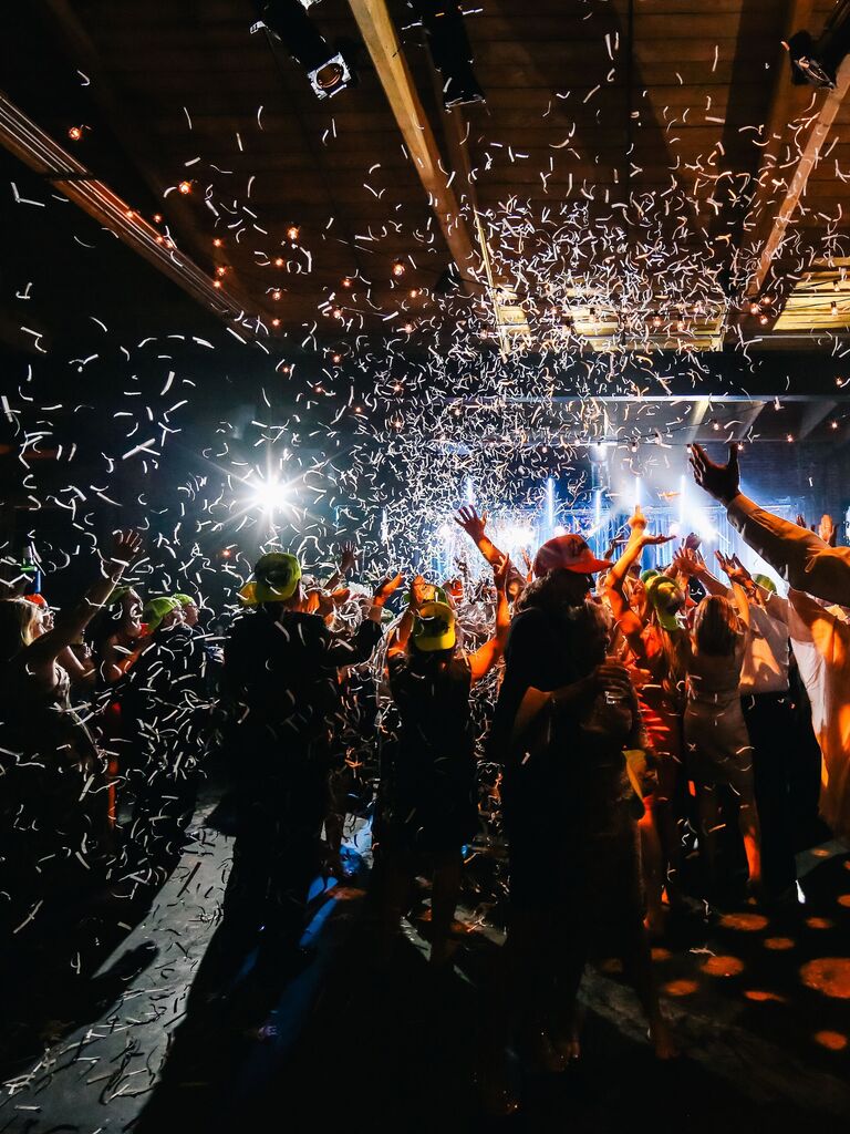 Confetti cannons at wedding after-party.