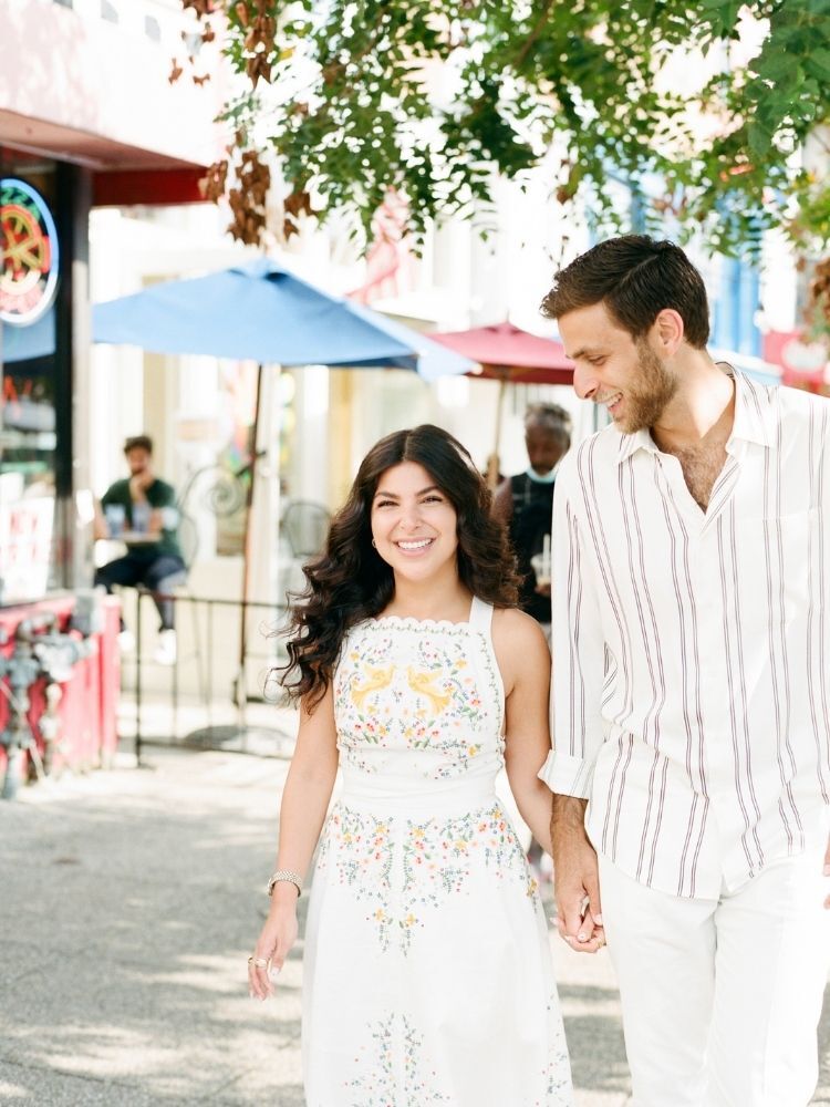 couple walking during spring engagement photo session