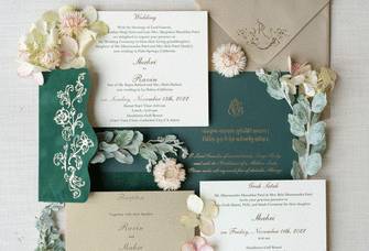 Green and neutral colored Indian wedding invitation suite. 