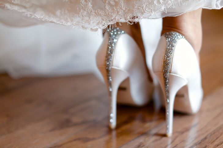 These bold sparkly Badgley Mischka bridal heels are not to be ignored: The stripe of silver sparkles down the back of these heels was a gorgeous glam touch to Chloe's classic bridal style.