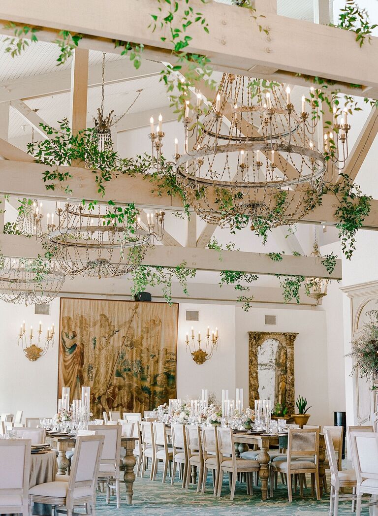 Rustic country club wedding reception with hanging greenery