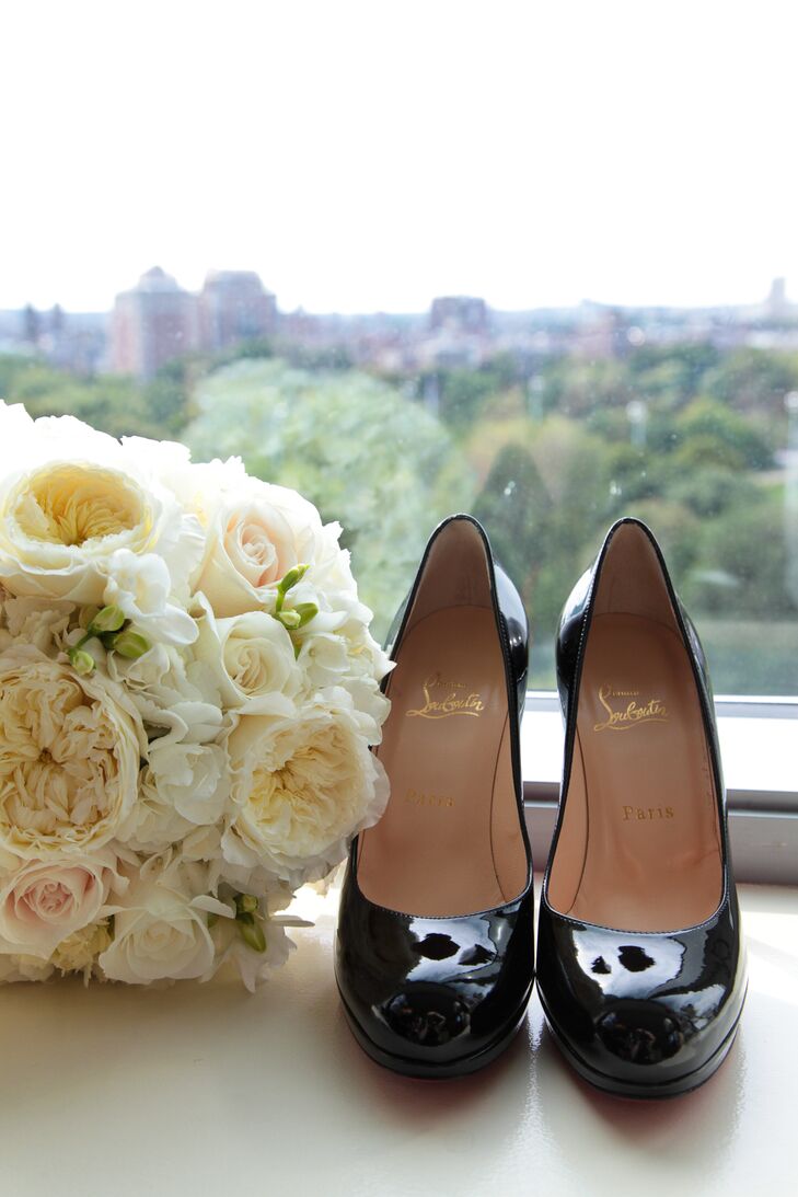 Laura carried a beautiful bouquet of white, cream and blush-colored roses with greenery down the aisle. And to actually get down the aisle, she wore a pair of fabulous black Christian Louboutin heels, which she described as her "favorite accessory."