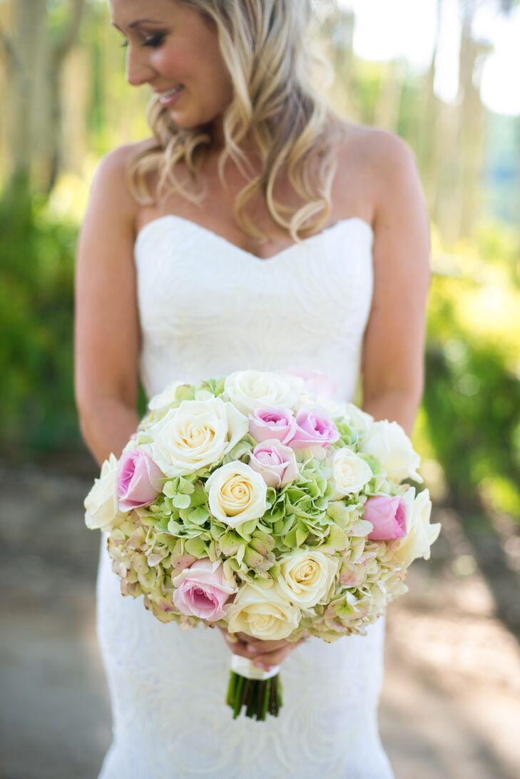 Ashley carried green hydrangeas and blush and ivory roses in her bouquet.