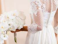 Woman in wedding dress holding bouquet