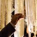 A unique alternative to a traditional escort card display, guests found their names and table assignments calligraphed on 120 acrylic escort cards hanging from the ceiling on white satin ribbons. The display was made into an arch so guests could walk underneath it and cut down their names. Bonus: they could take their cards home to use as a paper weight!