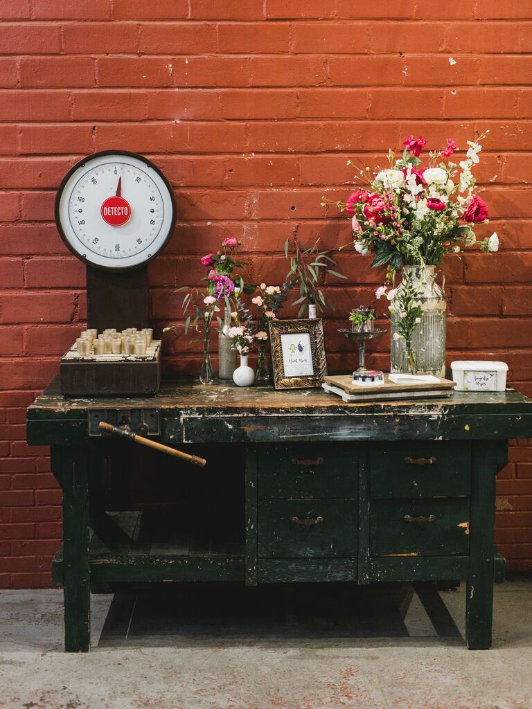 repurposed wooden work bench as unique wedding gift table and guest book display