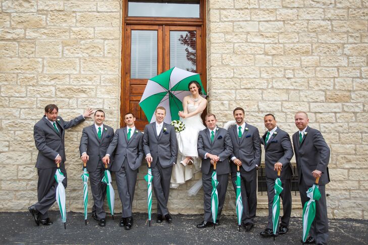 Michael and his groomsmen donned classic gray Vera Wang tuxes for the event, which they paired with emerald green ties to play up the wedding's color palette.