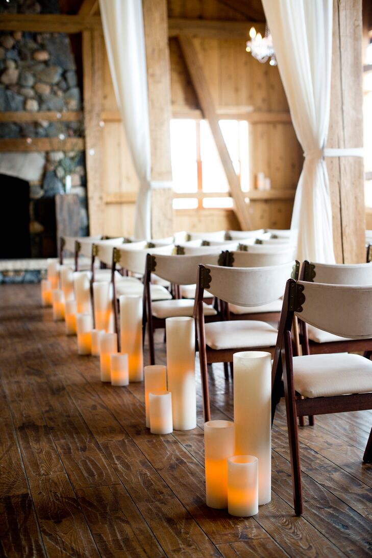 Instead of lining their aisle with flowers, Jemma and Matthew opted for ivory pillar candles. The candles tied into the warm, inviting and romantic feel they were trying to achieve.