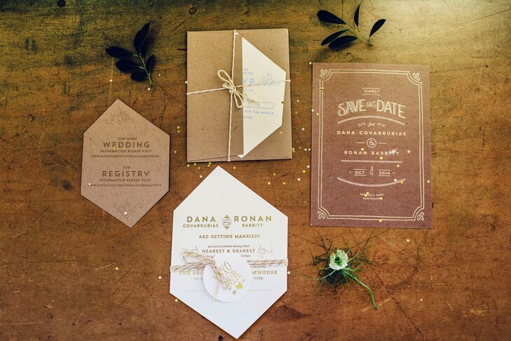 The gem-cut invitations were printed on kraft paper with gold foil-pressed lettering. The inside of the envelopes had gold gems, and the front was addressed to each guest with a gem above their name. The couple filled each invitation with silver and gold confetti and tied everything together with a metallic string.