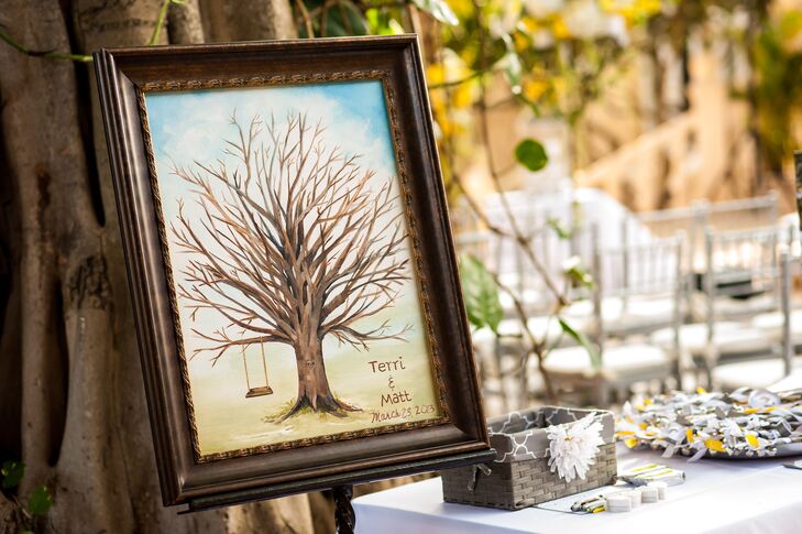 In lieu of a traditional guest book, Terry took a note from their Banyan tree-lined venue and had a banyan tree on a poster for their guests. “The goal was to make the bare tree come to life with peoples thumb prints or 'leaves' and each could sign their name under each print,” says Terri.