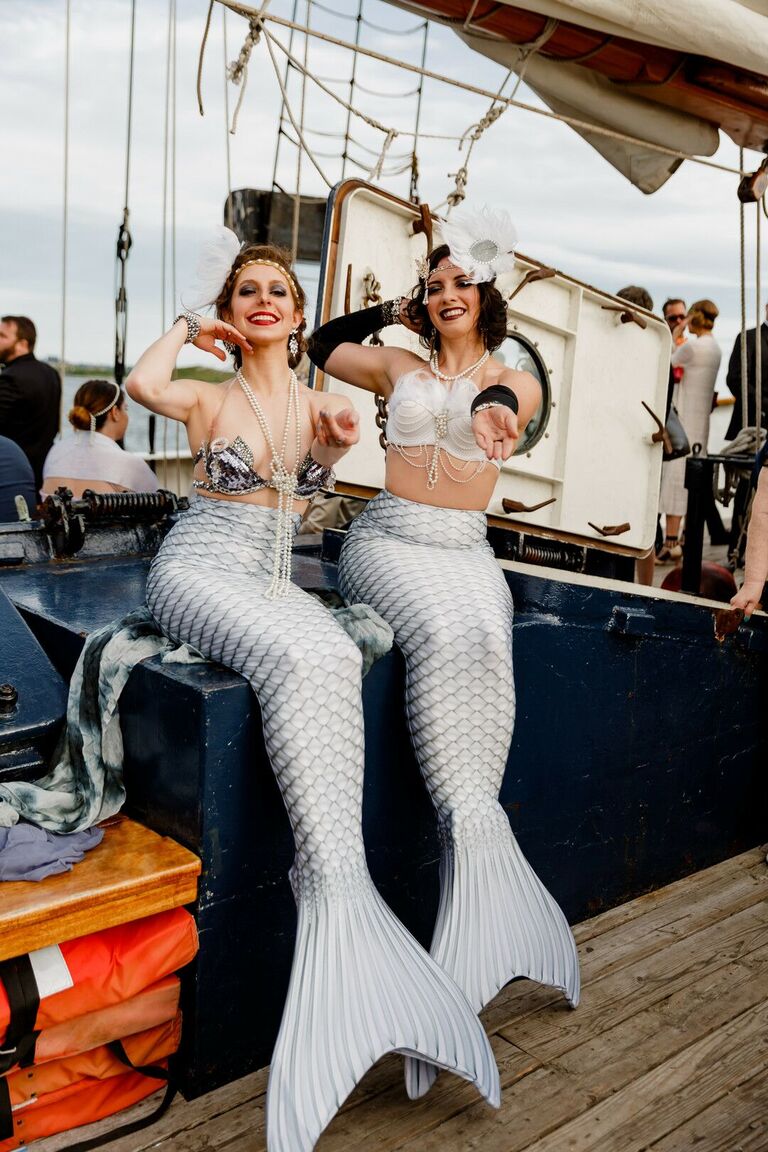 Mermaid entertainers on boat
