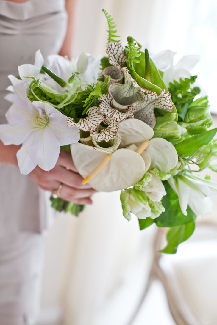 Tess's bridesmaids carried bouquets of neutral lilies with textured leafy greens.