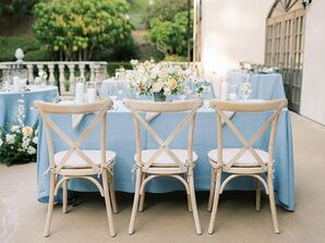 Cross-Back Chairs and Blue Table Linens for Backyard Wedding Reception