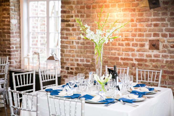 Though Shayna and Josh chose to keep the flowers to a minimum for the reception, subtle bunches of Shayna’s favorite blooms, calla lilies and orchids, in varying sizes topped alternating reception tables, infusing the historic mill space with an air of freshness and a light floral scent.