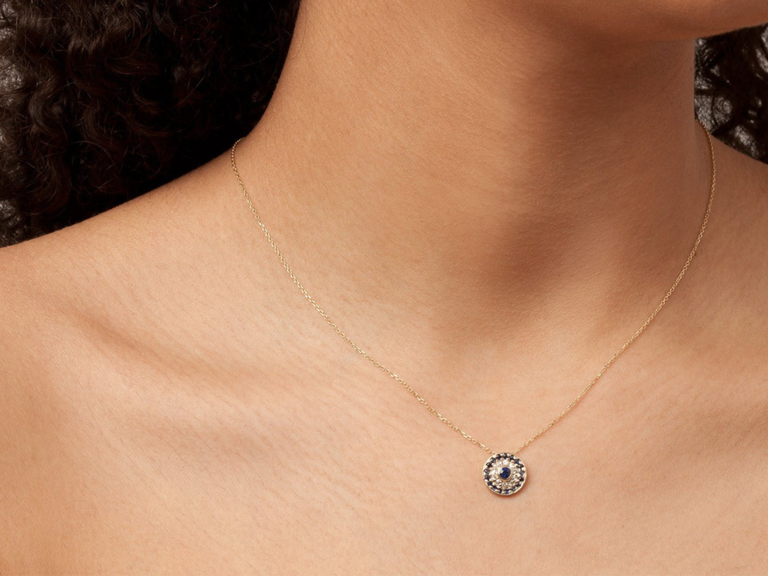 Round gold pendant necklace with round sapphires