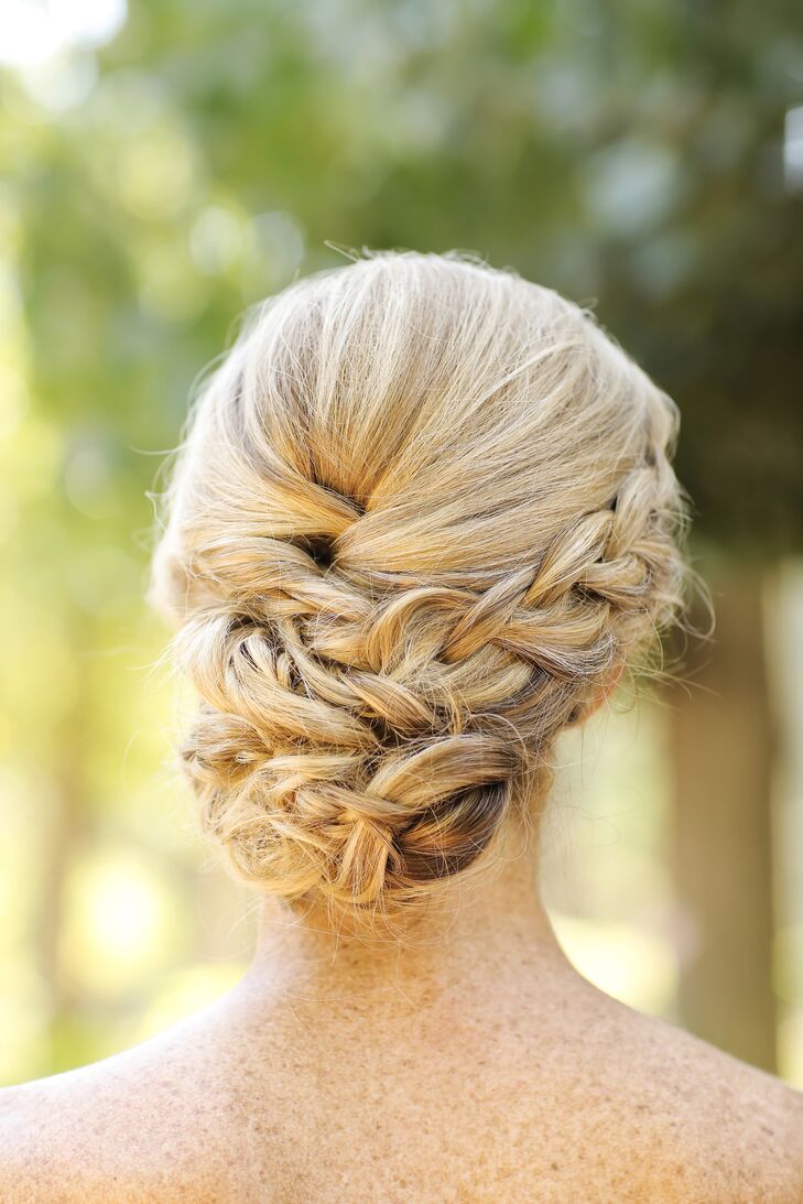 Courtney's side-braided updo by Holladay's Versa Artistry melded old-school romance with contemporary sensibilities.