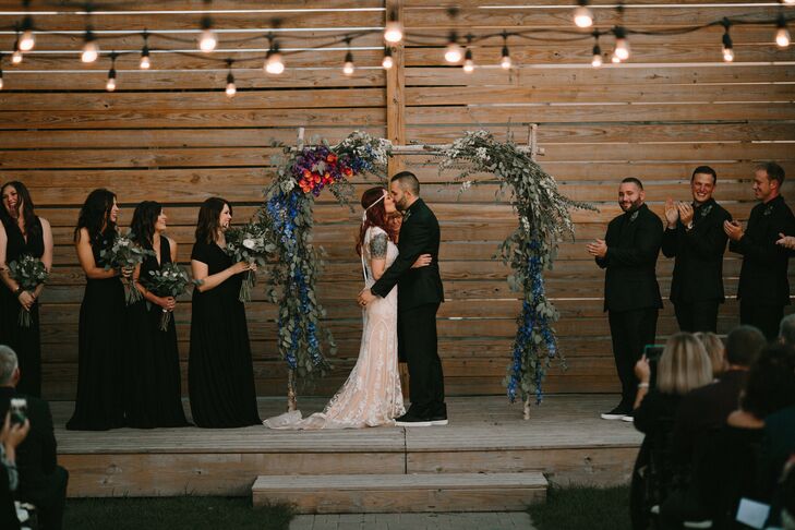 Couple's First Kiss under Bohemian Arch