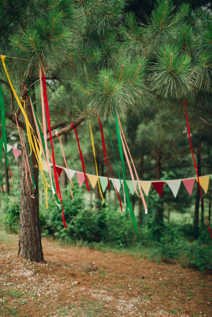 Red, yellow and green ribbon streamers, pennant flags and paper hearts decorated the outdoor wedding space where Namia and Jared said "I do."