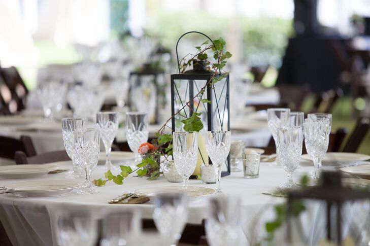 With a Great Gatsby and Nautical inspiration in mind, the couple accented each reception table with a black lantern  and ivy centerpiece.