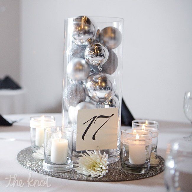 As a nod to the holiday season, Heather and Jared topped their tables with cylinder vases filled to the brim with silver ornaments.