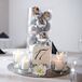As a nod to the holiday season, Heather and Jared topped their tables with cylinder vases filled to the brim with silver ornaments.
