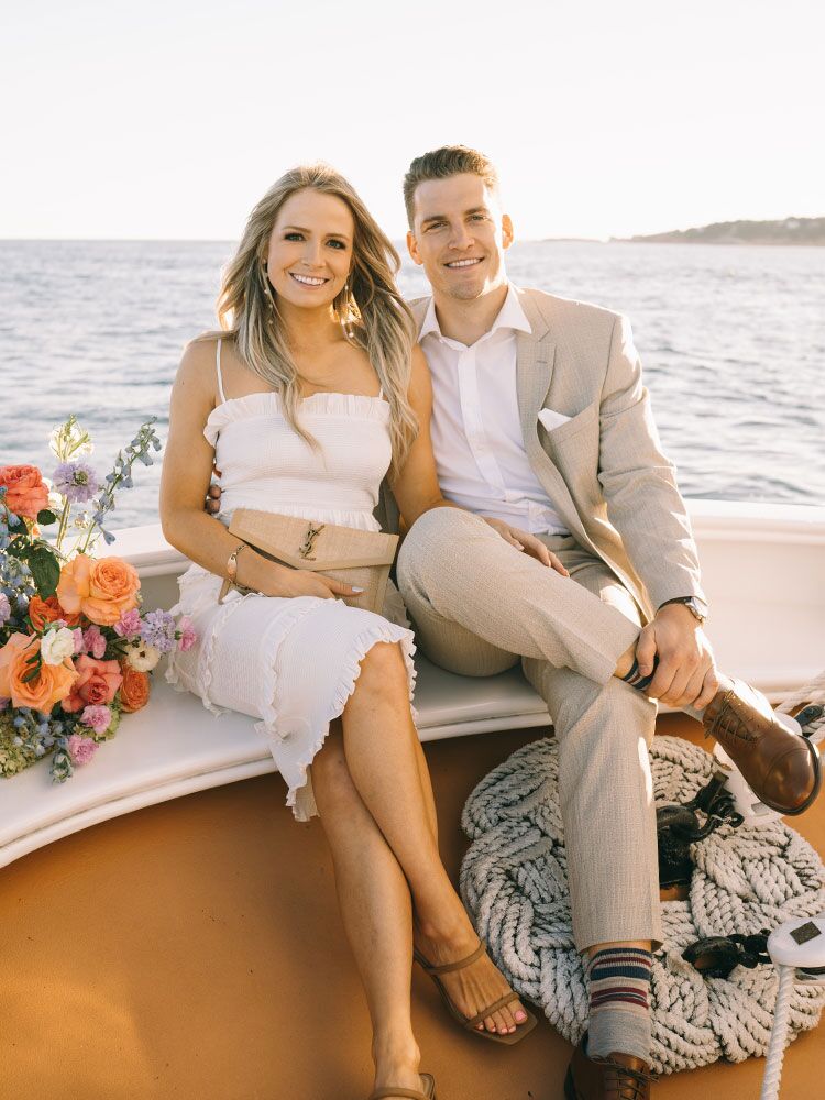 couple on boat for rehearsal dinner