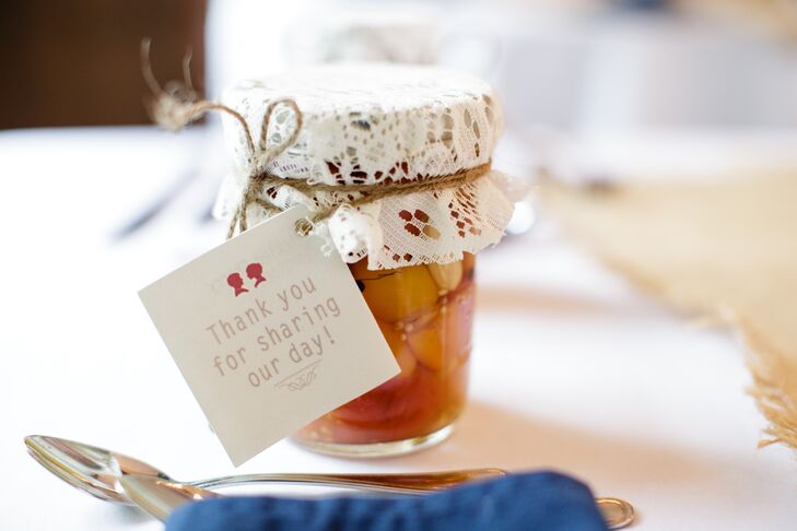 Marisa's mom made DIY wedding favors: jams, jellies, sauces and pickled things in mason jars. "I still have friends asking if we have any more," Marisa  says. Each mason jar had a custom "M & E" vintage-inspired label, tied with hemp onto a lace jar topper.