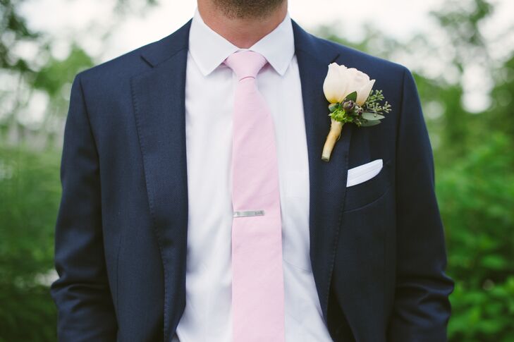 Lauren and Brian shared an inside joke with the idea of fancy boutonnieres, so Lauren decided to pick out two for him to wear throughout the day. Brian sported a single ivory rose boutonniere mixed with eucalyptus for the ceremony, and switched out boutonniere for the reception and dancing portion of the day.