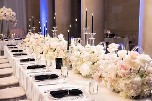 Long, Formal Dining Table With White Linen, Black Candles and Napkins, Low Floral Runner