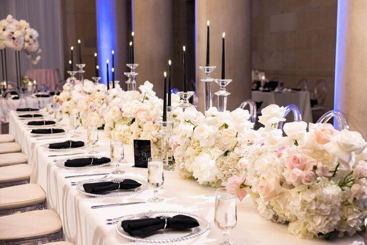 Long, Formal Dining Table With White Linen, Black Candles and Napkins, Low Floral Runner