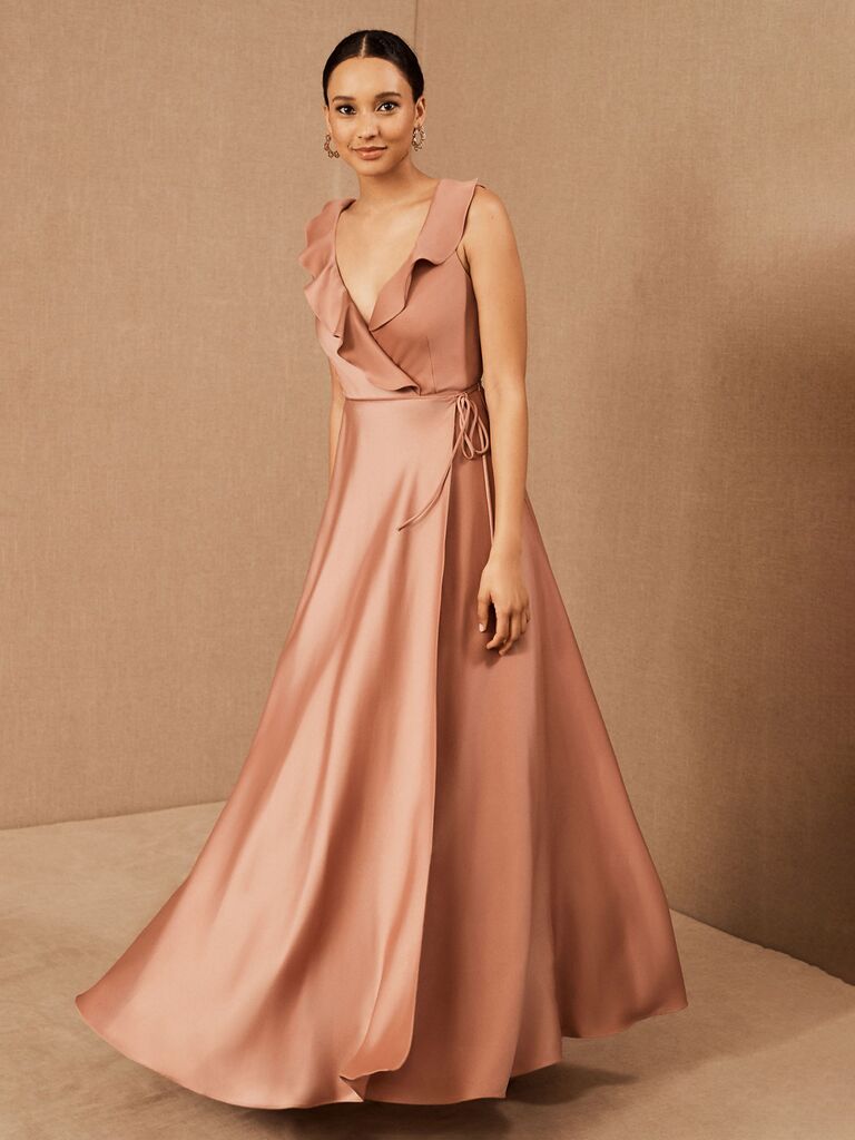 bhldn rose pastel dress for wedding guests with ruffle trimmed v-neckline and pleated flowy skirt