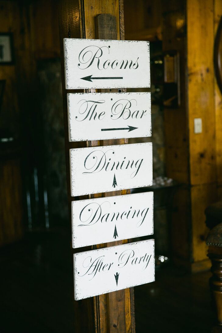 Inside the three-story reception lodge, a black-and-white wooden sign pointed guests in the right direction for the evening's festivities. "The reception was held on the middle level and then the third level was the party floor," Raquel says. "After the reception was over, everyone headed downstairs for the after-party."