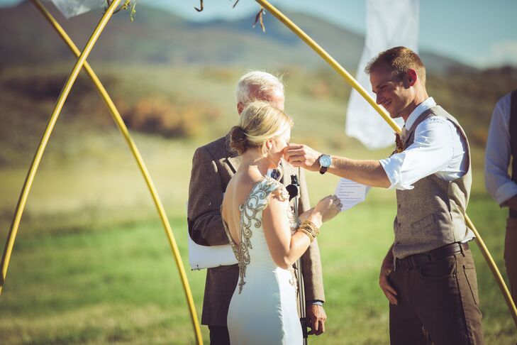 Kelsey and Joey's first Christmas together wasn't, in fact, together. Since they met in college, they were in different states for the holiday. Dying to see each other over the break, Joey flew Kelsey to Colorado where they went snowmobiling on his family's property. It meant so much to them that they exchanged vows in the same field years later.