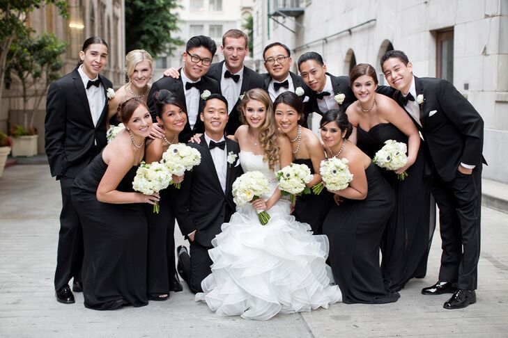 Huddled Bride and Groom With Wedding Party