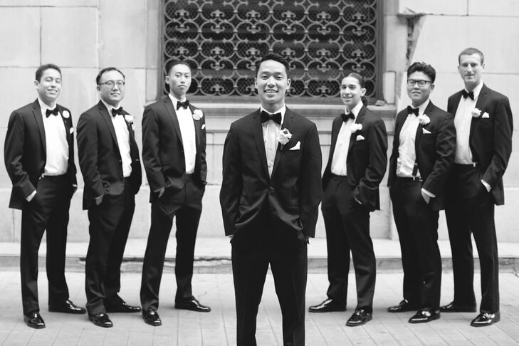 David and his groomsmen all wore fitted black tuxedos by Vera Wang with black bow ties, creating a classic look for the wedding day.
