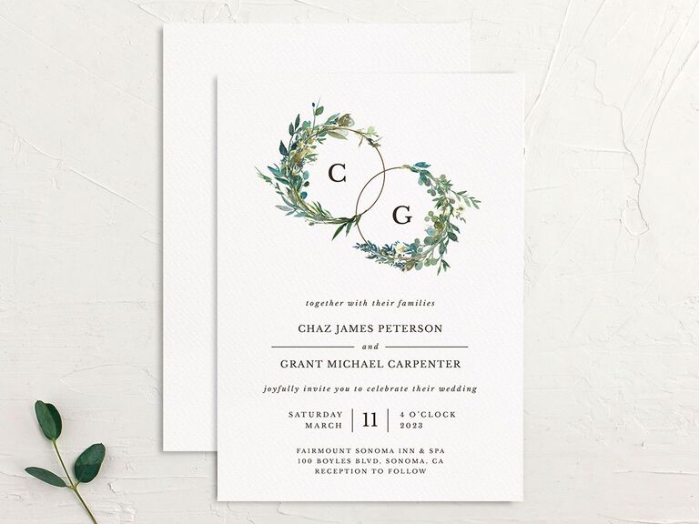 Rustic wedding invitation with greenery